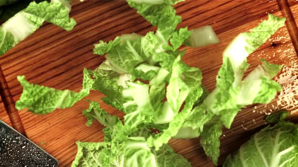 Pieces of Beijing Cabbage Fall on the Cutting Board