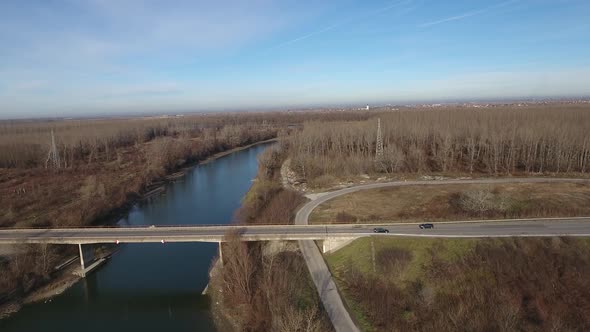 Black Car Crossing River Bridge