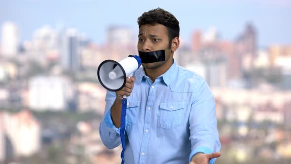 Emotional Man with Taped Mouth Trying To Speak