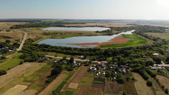 Natural Landscape of Central Russia with Field, River and Pond in Fall. Downward Movement