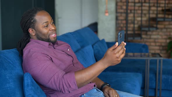 Black Man Using Smartphone for Video Call