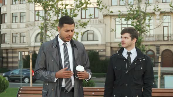 The Strolling Men Discuss Something Serious