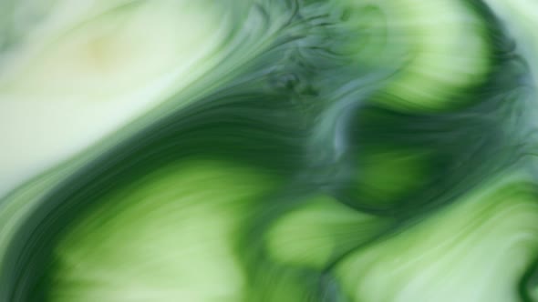 Ink in Water, Green Ink Reacting in Water Creating Abstract Background