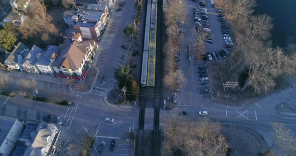 Top View Tilt Down of a Street Intersection and Train Tracks