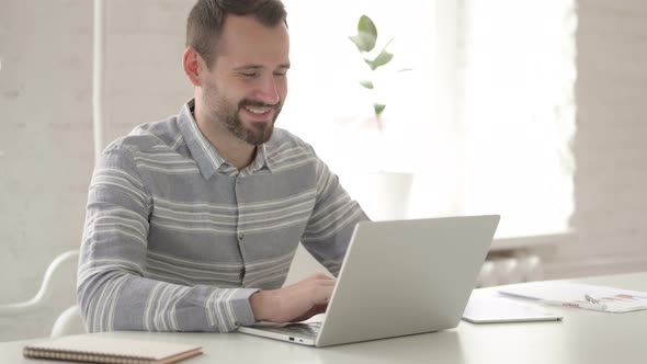 Video Chat Via Laptop By Adult Young Man