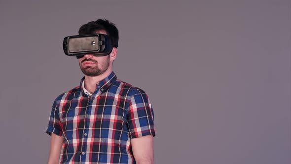 Young Man Working in Virtual Reality Glasses