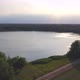 Countryside Dramatic and Colorful Sunset Flight Over a Forest Lake Aerial Shot on a Drone - VideoHive Item for Sale