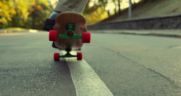 Man Performs a Trick on a Skateboard, Longboard. View From Below.