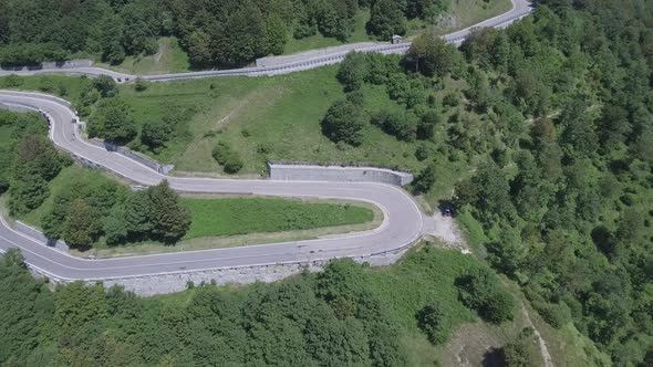 Aerial view of a winding mountain road in Italy