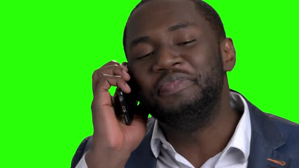 Excited Afro American Businessman Talking on Phone.