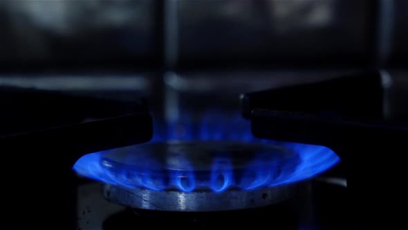 Gas Burners in the Kitchen Oven. Close Up. Slow Motion