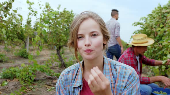 Handsome Woman with a Large Smile in the Vineyard