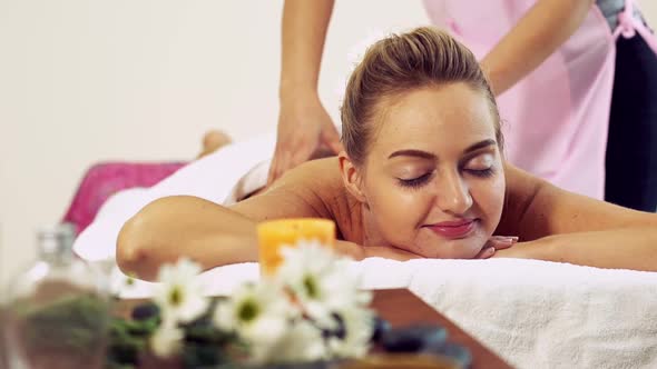 Woman Gets Back Massage Spa By Massage Therapist