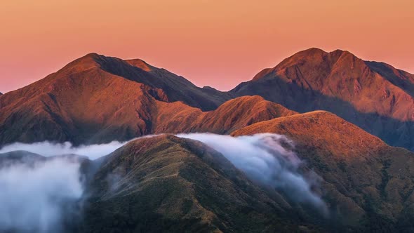Beautiful Evening Sunset over Misty Alpine Mountains in Wild New Zealand Landscape