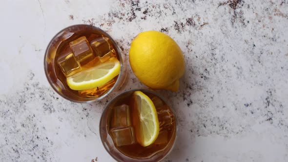 Whiskey Sour Drink with Lemon in Glass on Stone Rustical Background