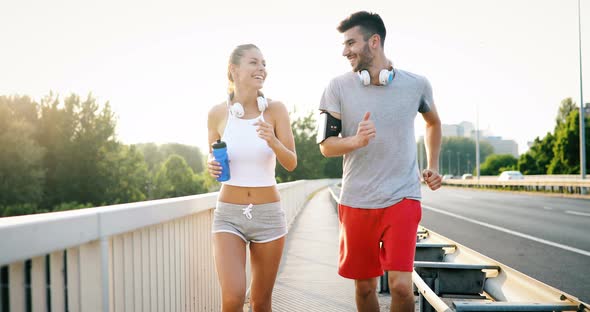 Attractive Man and Beautiful Woman Jogging Together