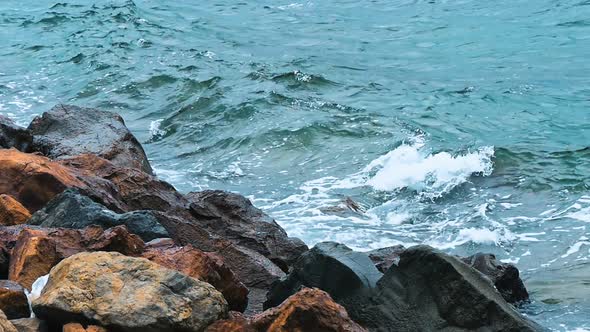 Powerful Waves Crushing on a Rocky Beach