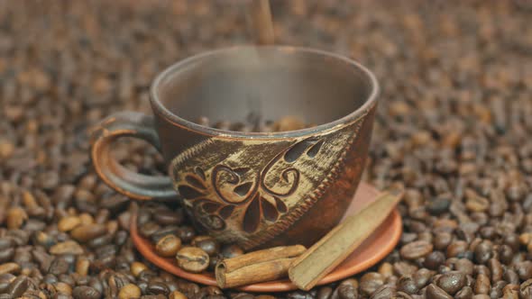 Coffee Beans Poured Into A Beautiful Cup