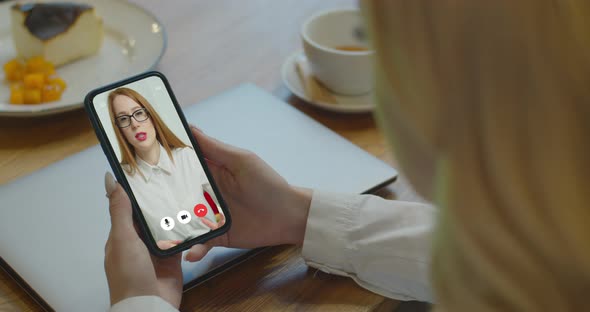 Woman Studying at Cafe Online By Conference Video Call Smartphone Speak Communicates Teacher