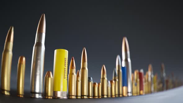 An endless row of different ammunition types standing on the ground in a loop.