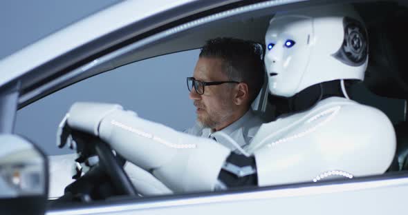 Scientists Testing a Car Driving Robot