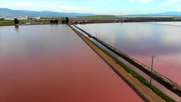 Low Aerial of Power Lines Over Evaporation Ponds