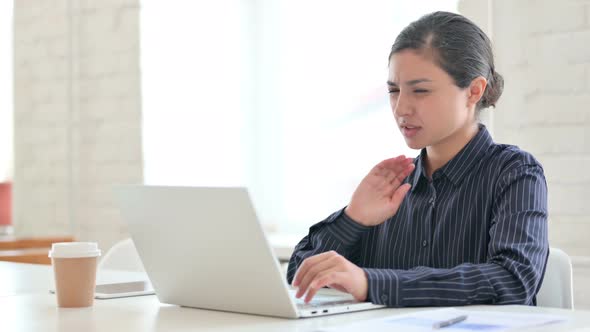 Tired Young Indian Woman Having Neck Pain at Work