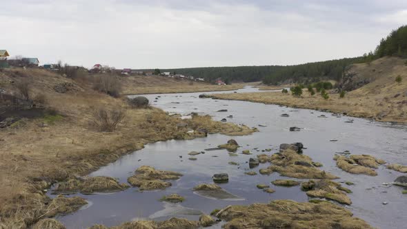 Aerial View of the River with Large Rocks in the Riverbed.