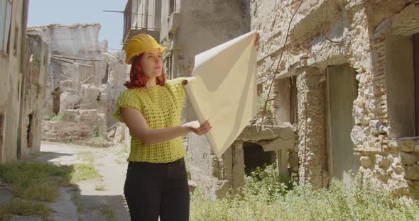 Rescuer looks at a map of a city destroyed by the war in Ukraine