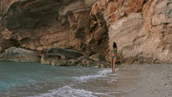 Woman Walking on the Beach