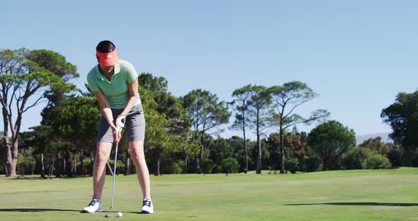 Female golfer playing golf