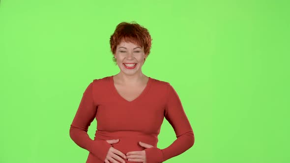 Woman Advertises the Products and Shows a Thumbs Up. Green Screen