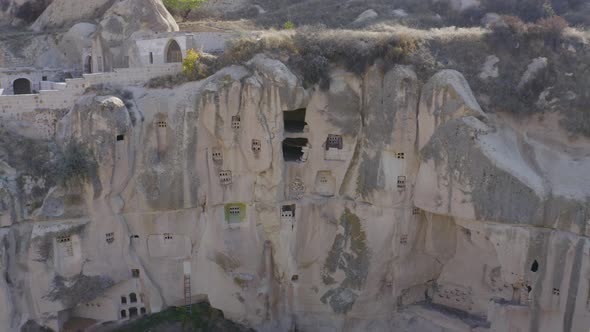Natural Volcanic Rocks with Ancient Cave Houses in Cappadocia, Turkey.