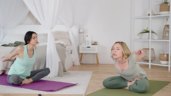 Yoga Trainer Showing Stretch Exercises During Private Class at Home