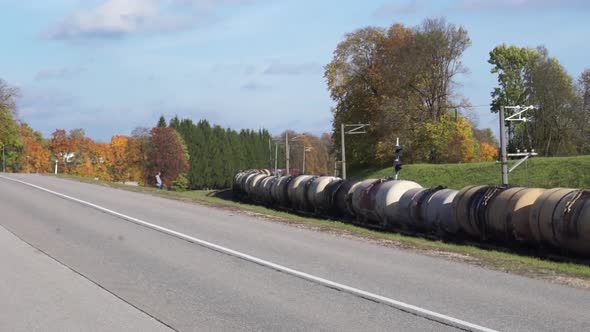 Cargo train going through autumn