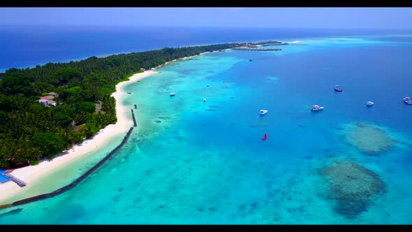 Aerial drone landscape of tranquil island beach journey by blue green water and white sand backgroun