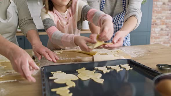 Video of little girl making Easter cookies with family. Shot with RED helium camera in 8K.