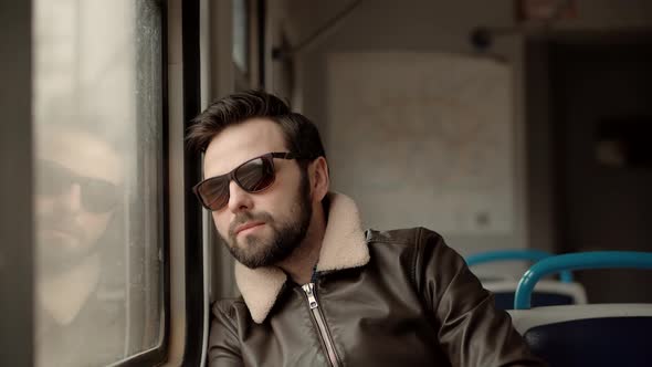 Sad Man Looking On Train Window Worried On Problem. Man Under Stress Work After Fired Job On Tram.