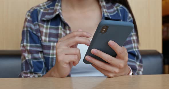 Woman use cellphone order at restaurant 