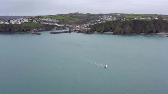 Fishing Boat Leaving Port on a Grey Overcast Day