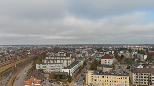 Aerial View of Mazeikiai City, Lithuania. Residential Buildings, Streets  and Railway in Suburbs, Pa