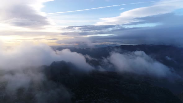 Mountain Peaks and Morning Sky with Smooth Moving Clouds