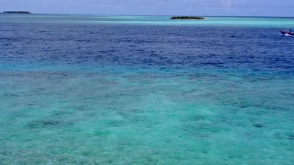 Sunny nature of tropical bay beach by clear sea with sand background near resort