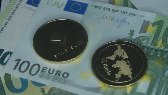 Cryptocurrency Coins Lying on the Euro Banknotes