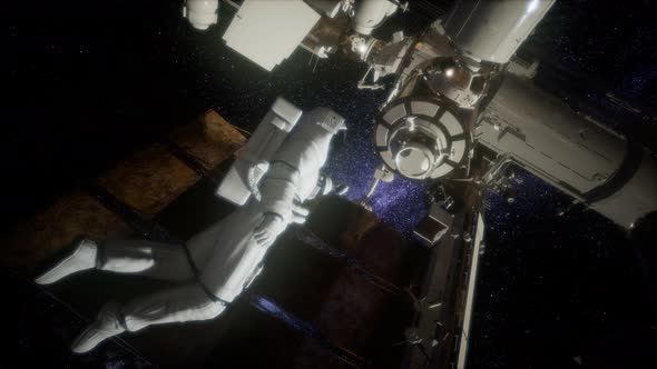 Astronaut Outside the International Space Station on a Spacewalk alt