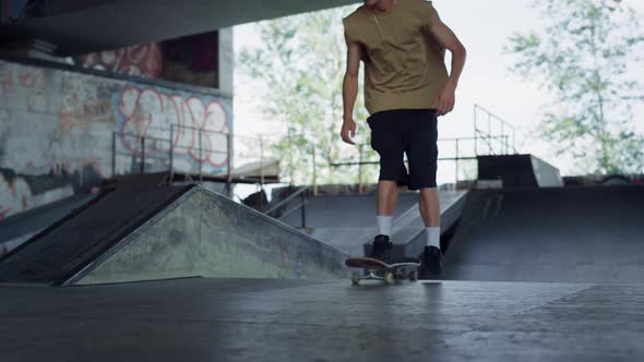 Extreme Teenager Skateboarding in Urban Skatepark