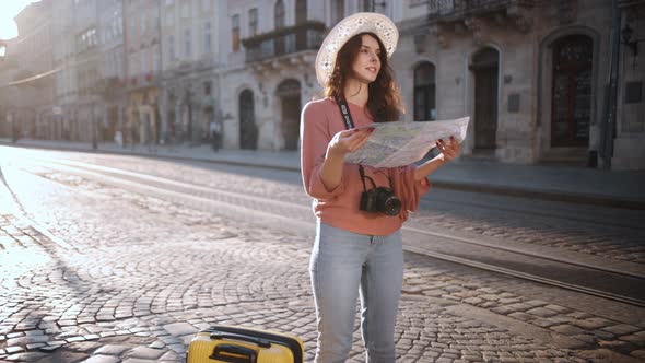 Slow Motion Hipster Girl Holds Tourist Map Enjoying Vacation Lady Walking Down Street Looking Way