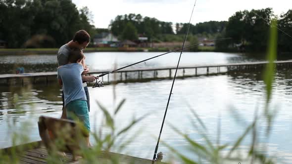 Positive Dad and Son with Rod Angling at Pond