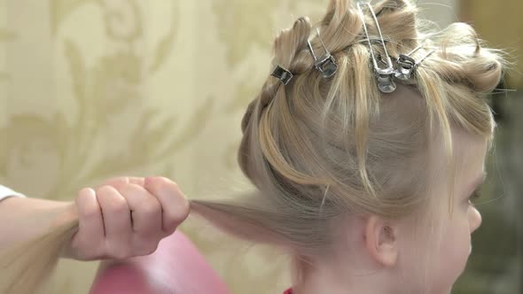 Hands Brushing Hair of Child