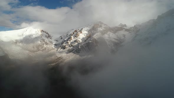 Foggy Clouds In Winter Mountains